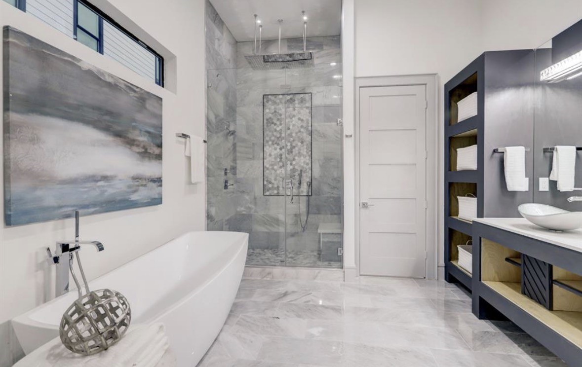 1709 Reverse Street Houston, TX 77055 - Photo 22 of 29 a bathroom with a bathtub and a shower