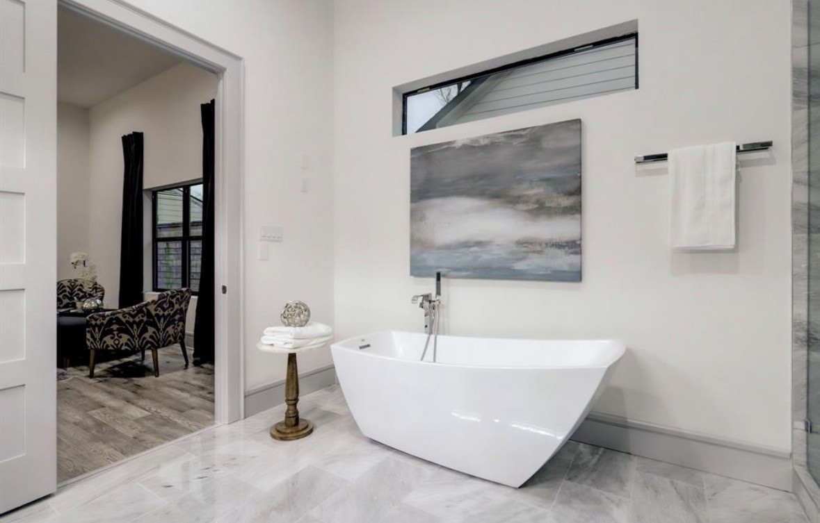 1709 Reverse Street Houston, TX 77055 - Photo 25 of 29 a bathroom with a white tub and shower