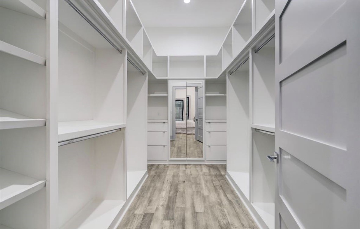 1709 Reverse Street Houston, TX 77055 - Photo 26 of 29 a view of walk in closet with wooden floor