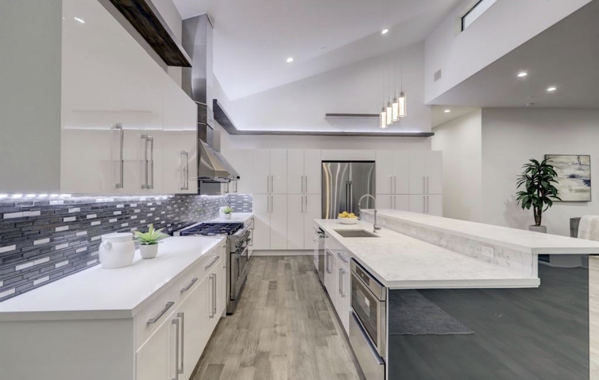 1709 Reverse Street Houston, TX 77055 - Photo 5 of 29 a large kitchen with a sink and stove