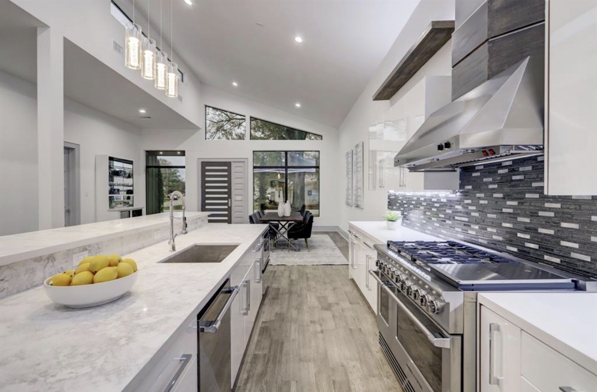1709 Reverse Street Houston, TX 77055 - Photo 7 of 29 a kitchen with sink stove and chairs