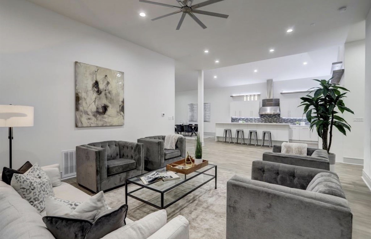 1709 Reverse Street Houston, TX 77055 - Photo 10 of 29 a living room with furniture and a chandelier