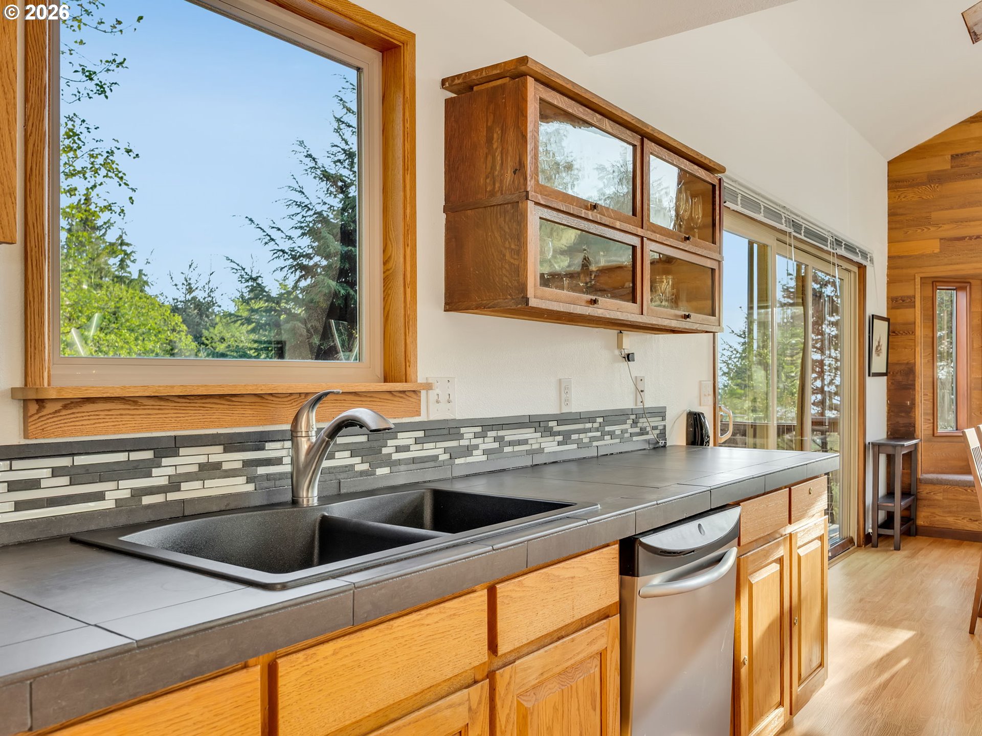 80248 Woodland Heights Road Arch Cape, OR 97102 - Photo 12 of 33 a kitchen that has a sink and a window