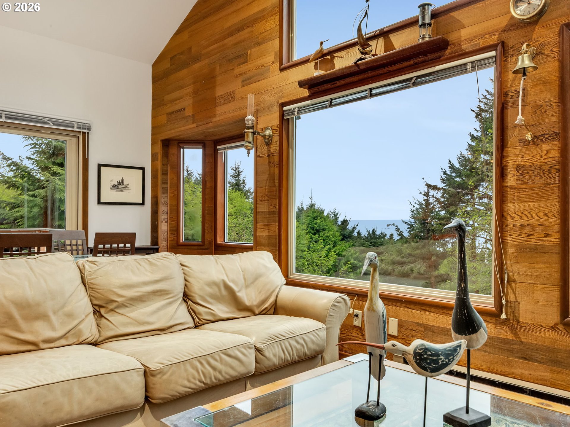 80248 Woodland Heights Road Arch Cape, OR 97102 - Photo 6 of 33 a living room with furniture and a large window
