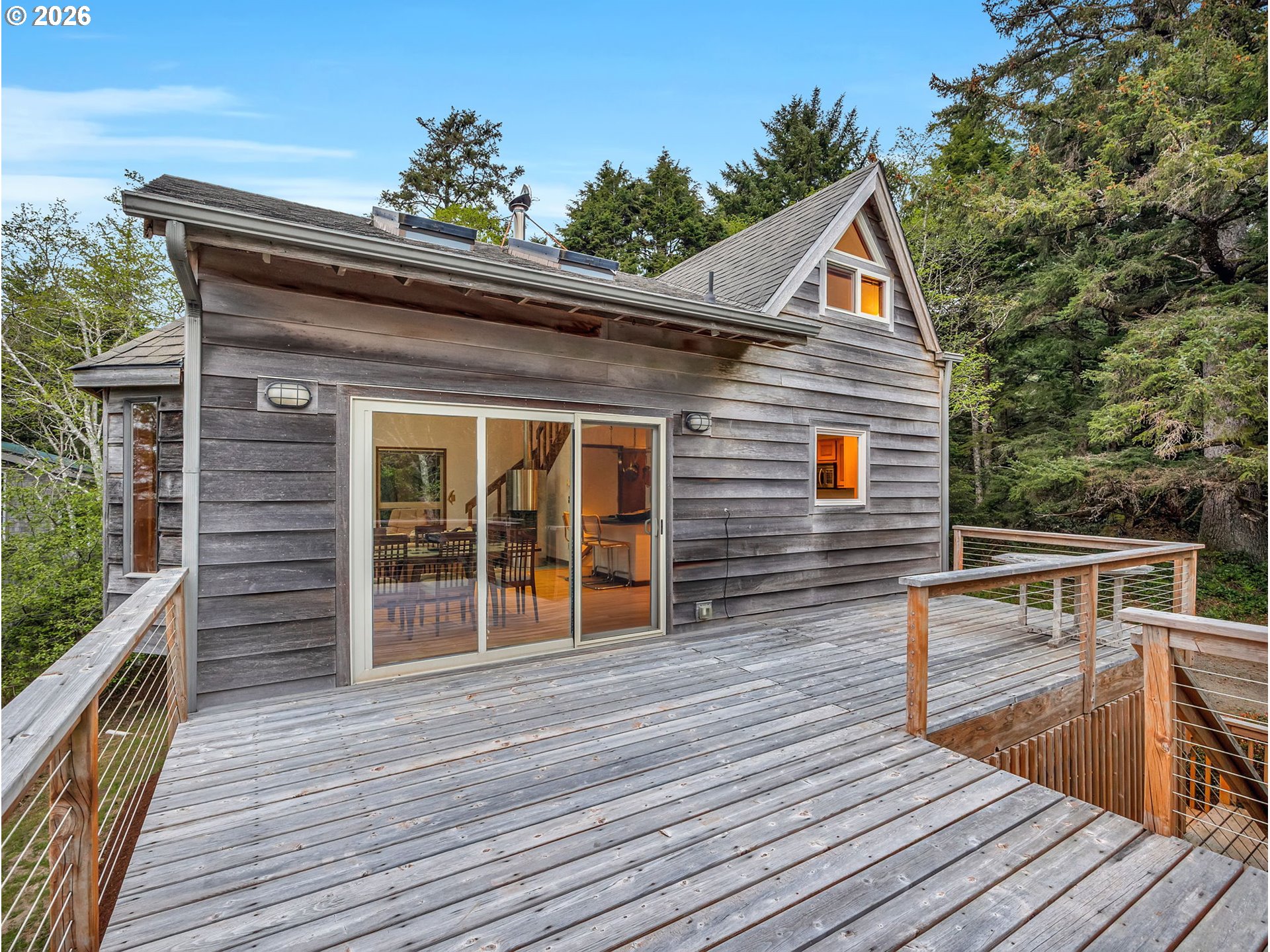 80248 Woodland Heights Road Arch Cape, OR 97102 - Photo 10 of 33 a view of house with wooden deck and furniture
