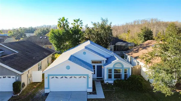 a house with trees in the background