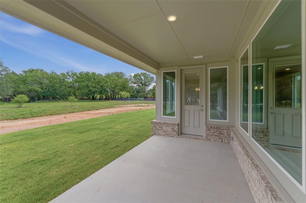156 Oak Grv Way Springtown, TX 76082 - Photo 21 of 25 Covered patio with a concrete surface and recessed lighting