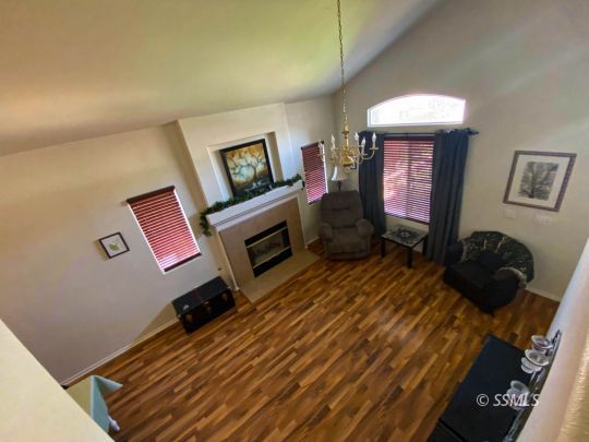 1109 Rebecca Avenue Ridgecrest, CA 93555 - Photo 15 of 50 a bedroom with a bed and a television