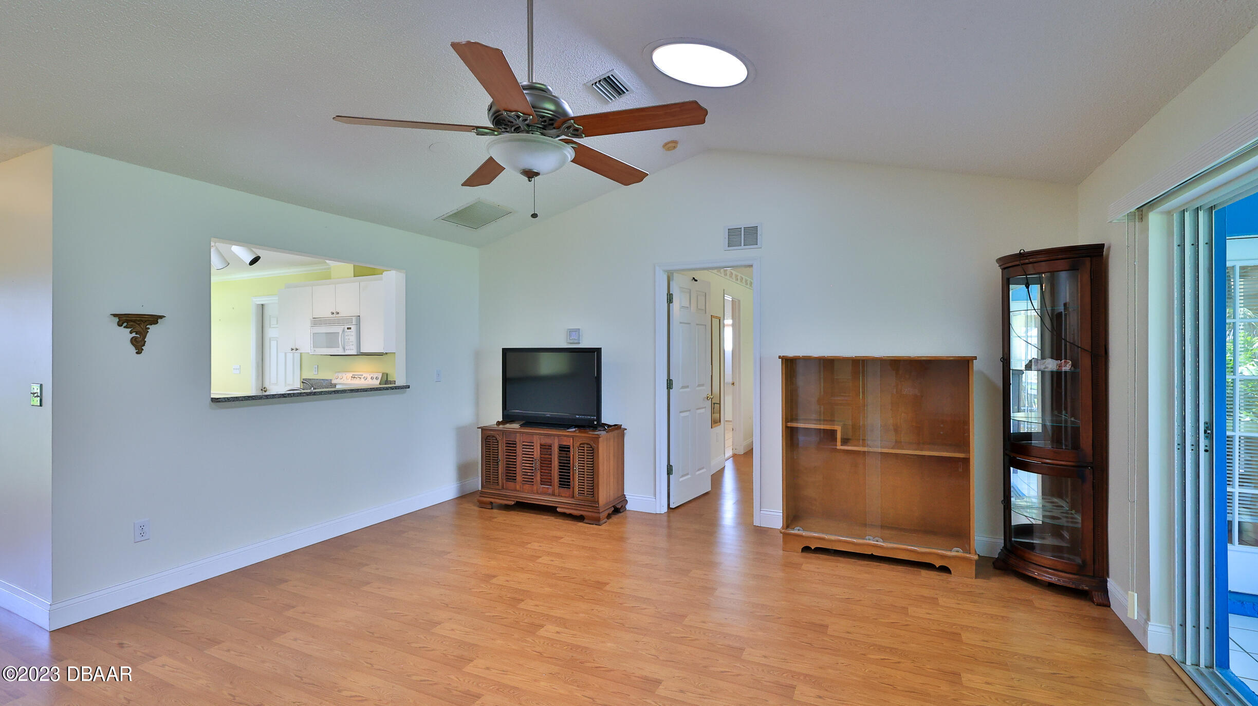 107 Sandpiper Ridge Drive Ormond Beach, FL 32176 - Photo 14 of 53 a view of a livingroom with furniture a ceiling fan and wooden floor