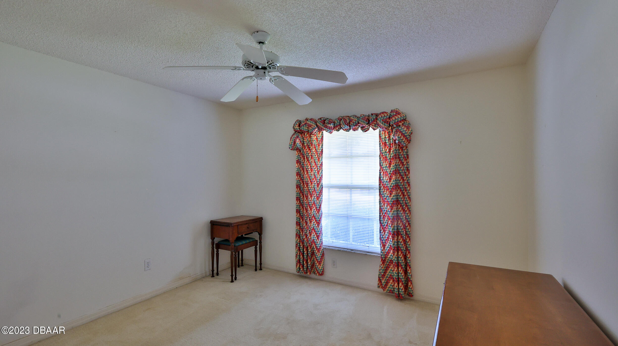 107 Sandpiper Ridge Drive Ormond Beach, FL 32176 - Photo 19 of 53 an empty room with windows and fan