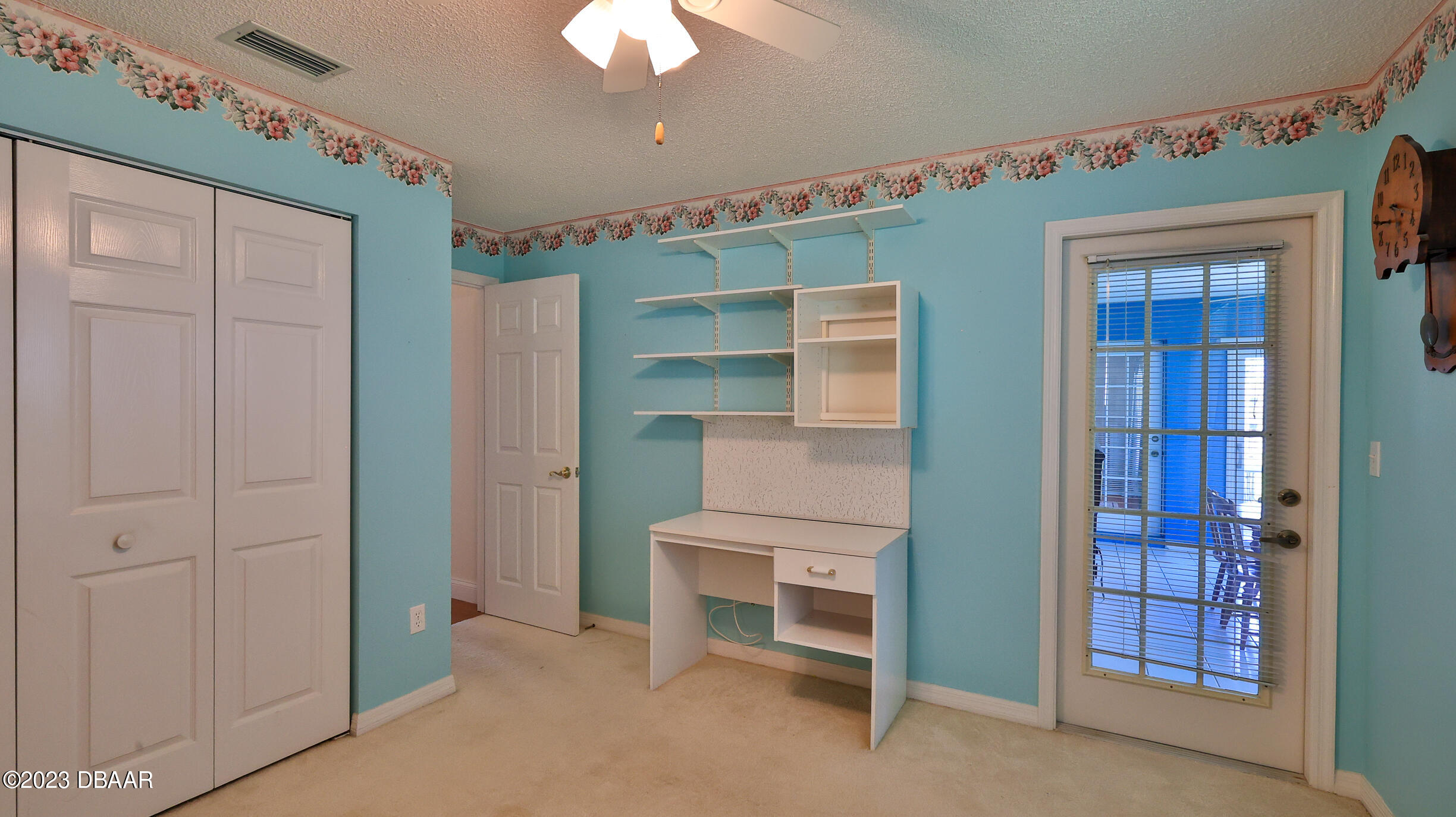 107 Sandpiper Ridge Drive Ormond Beach, FL 32176 - Photo 24 of 53 a room that has a bed and a chair in it