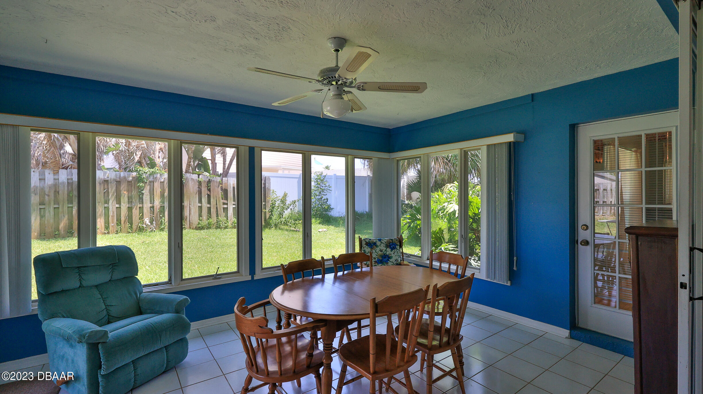 107 Sandpiper Ridge Drive Ormond Beach, FL 32176 - Photo 25 of 53 a dining room with furniture a chandelier and large window