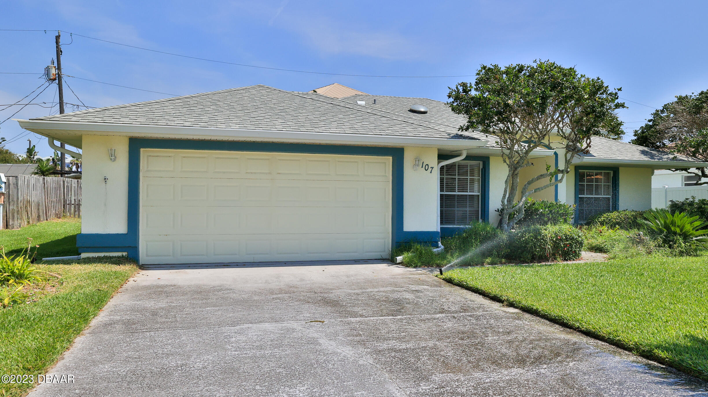 107 Sandpiper Ridge Drive Ormond Beach, FL 32176 - Photo 3 of 53 a front view of a house with a yard and garage