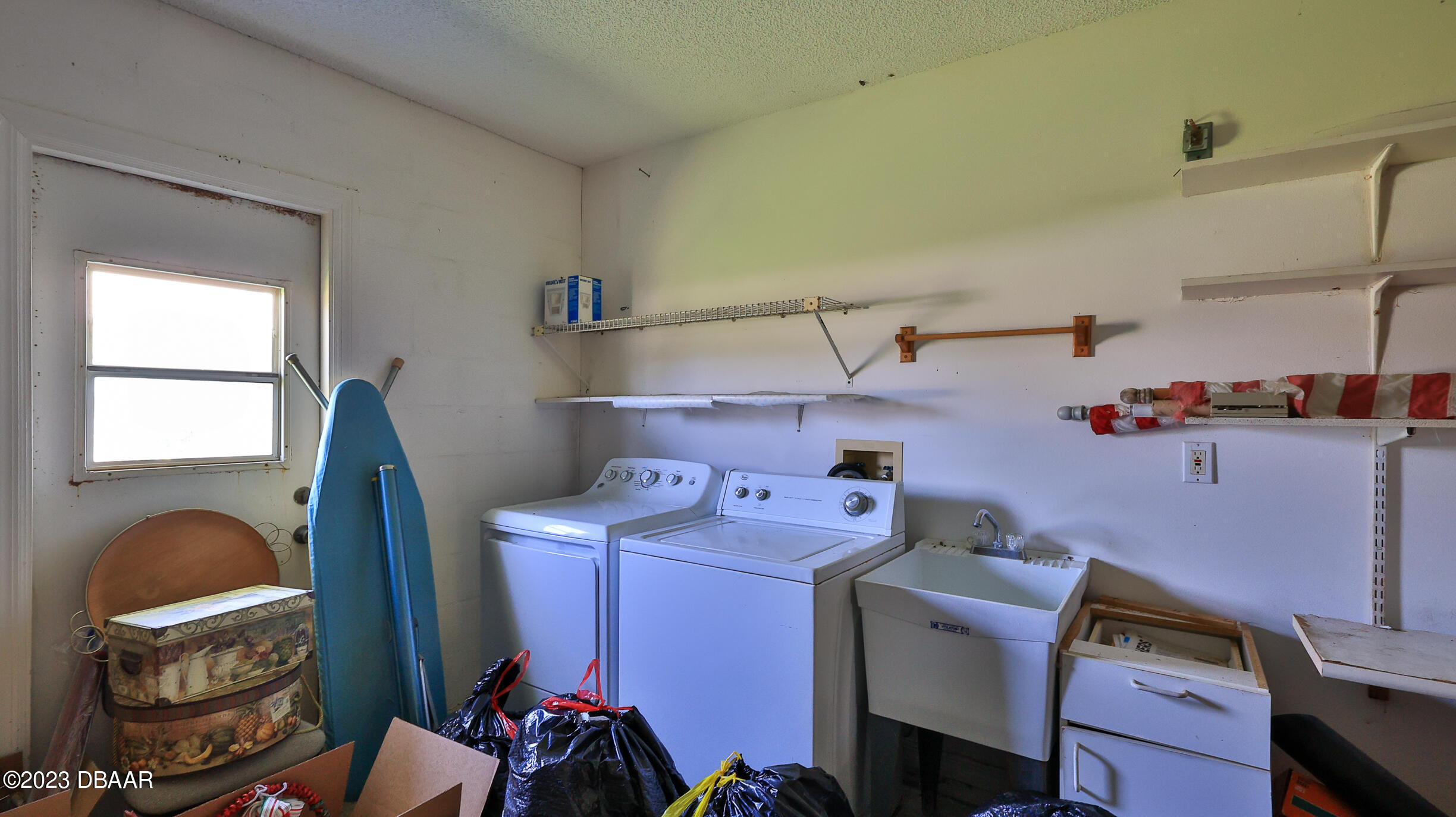 107 Sandpiper Ridge Drive Ormond Beach, FL 32176 - Photo 31 of 53 a utility room with dryer and washer