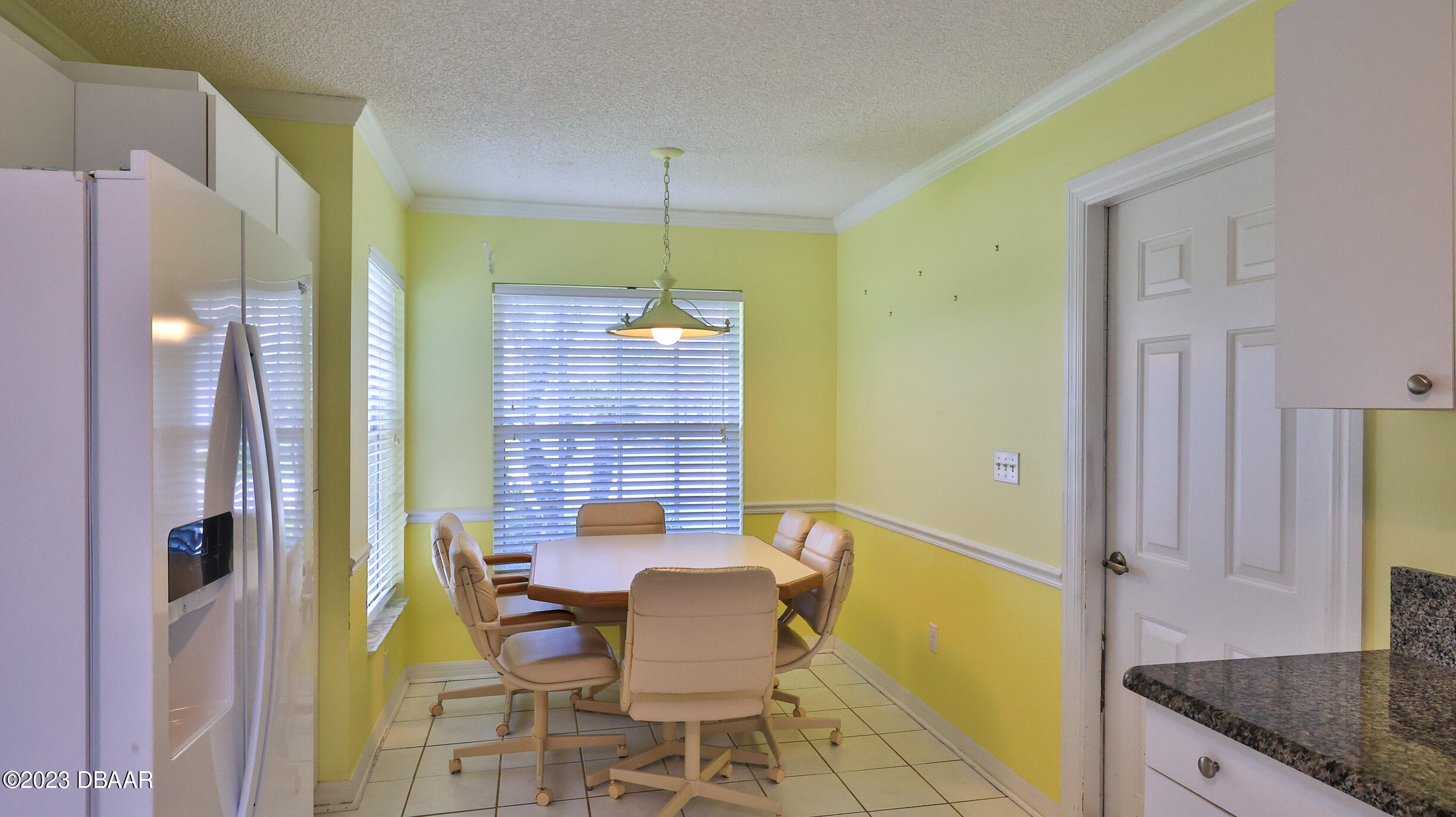 107 Sandpiper Ridge Drive Ormond Beach, FL 32176 - Photo 6 of 53 a view of a dining room with furniture and a chandelier