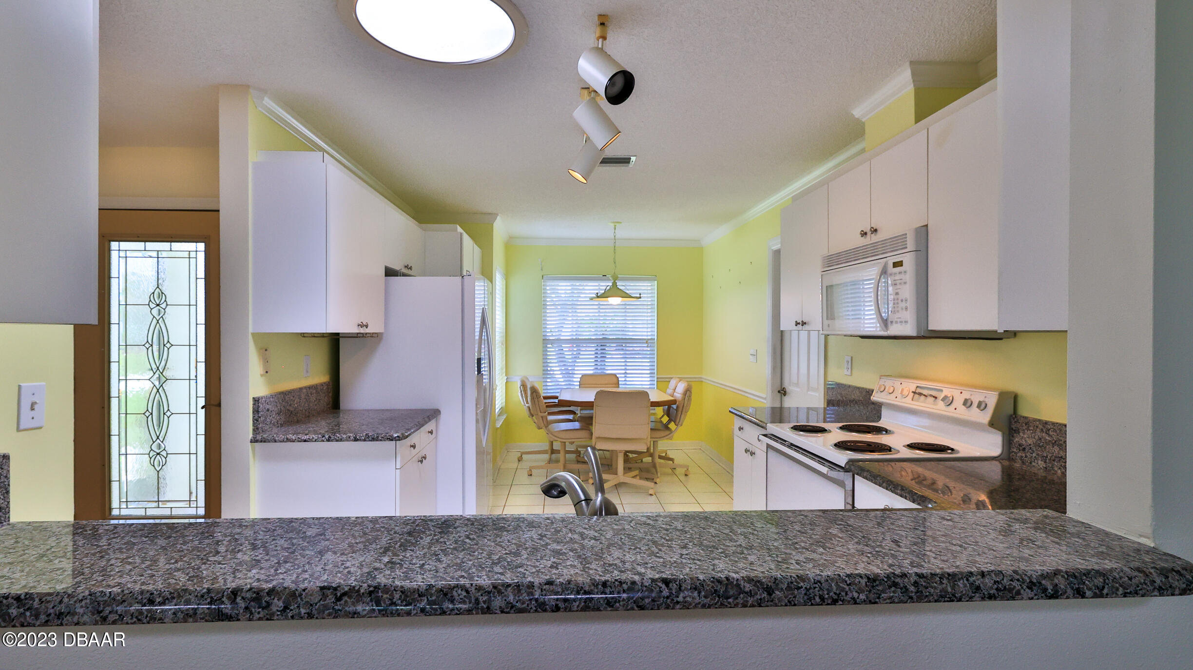 107 Sandpiper Ridge Drive Ormond Beach, FL 32176 - Photo 10 of 53 a living room with fireplace furniture and a rug