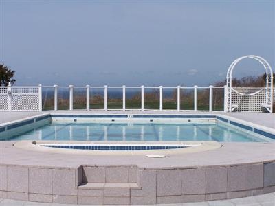 Undisclosed Address Falmouth, MA 02540 - Photo 5 of 6 a house view with swimming pool and glass windows