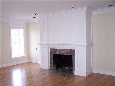 Undisclosed Address Falmouth, MA 02540 - Photo 6 of 6 a living room with a fireplace and a fireplace