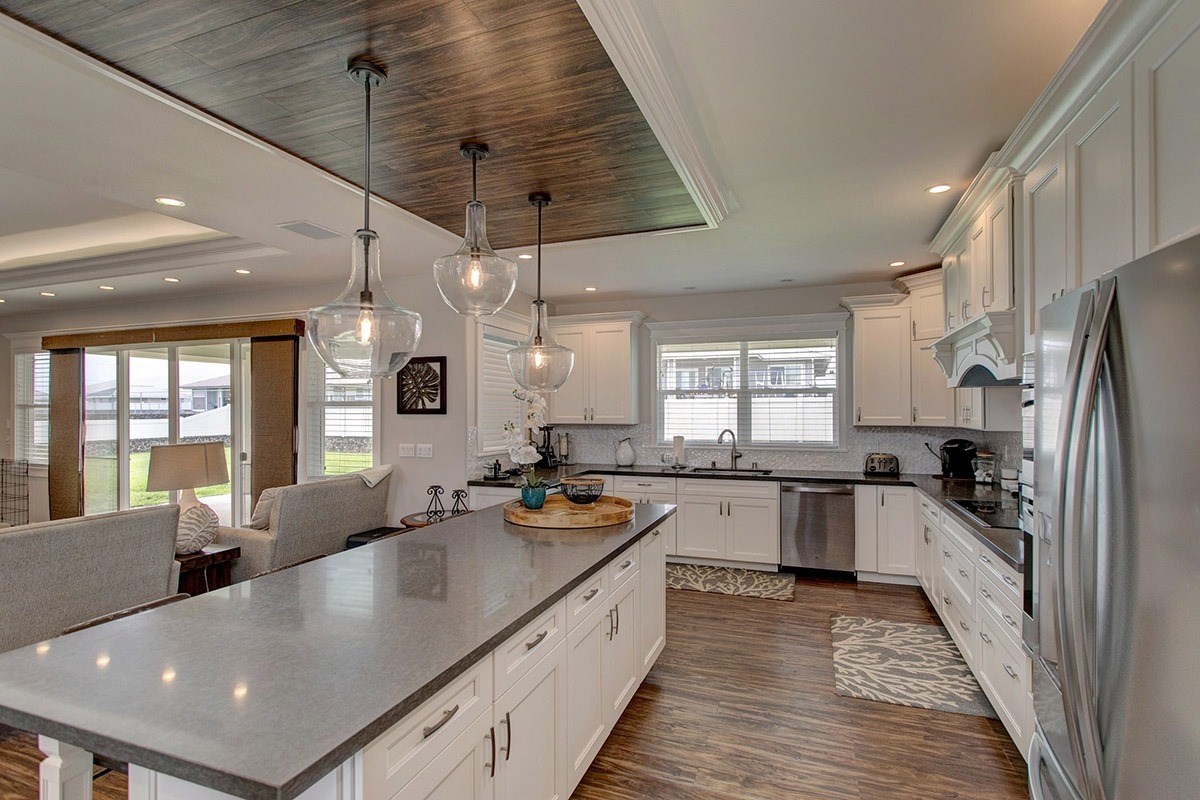 3047 Lou Street Hilo, HI 96720 - Photo 15 of 30 a large kitchen with stainless steel appliances granite countertop a sink a stove and refrigerator
