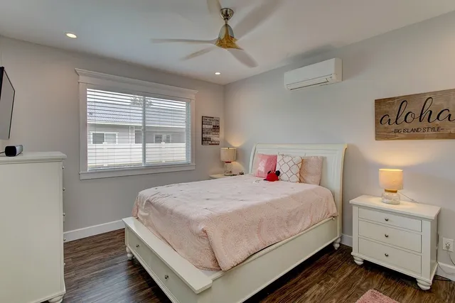 a bedroom with a bed and a dresser