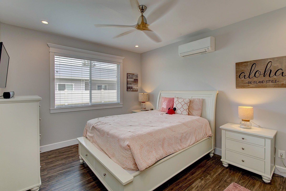 3047 Lou Street Hilo, HI 96720 - Photo 24 of 30 a bedroom with a bed and a dresser