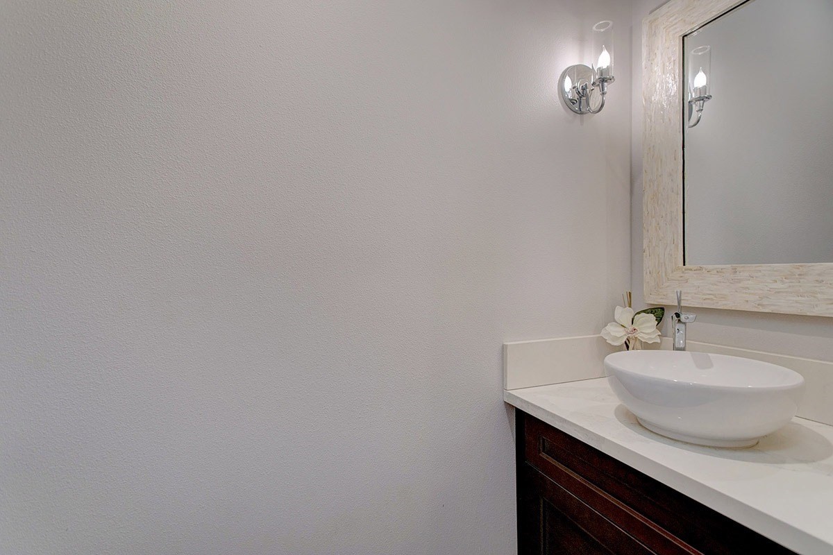 3047 Lou Street Hilo, HI 96720 - Photo 28 of 30 a bathroom with a sink and a mirror