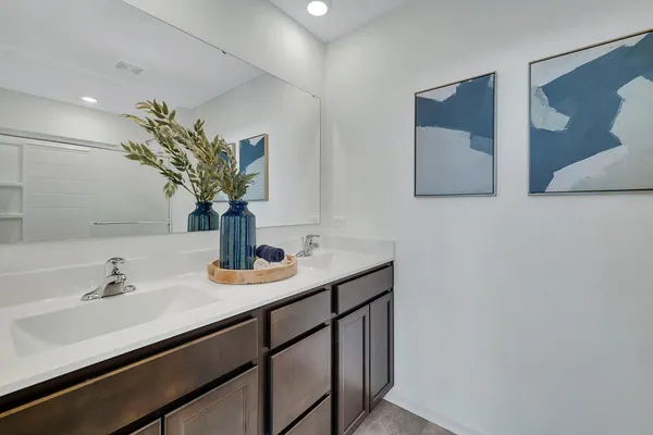 a bathroom with a sink a vanity and a mirror