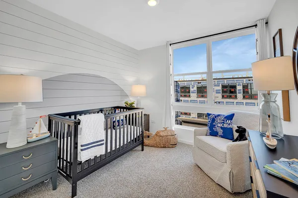 a bedroom with furniture and a window