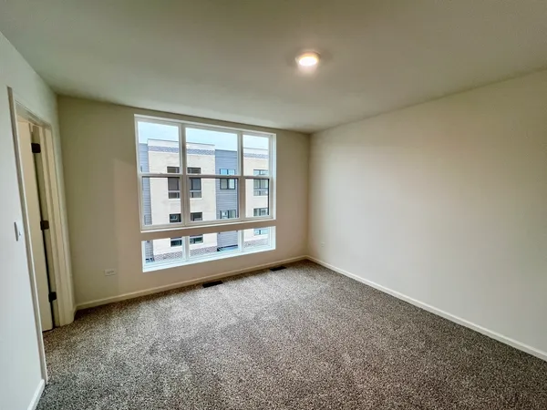 an empty room with a fireplace