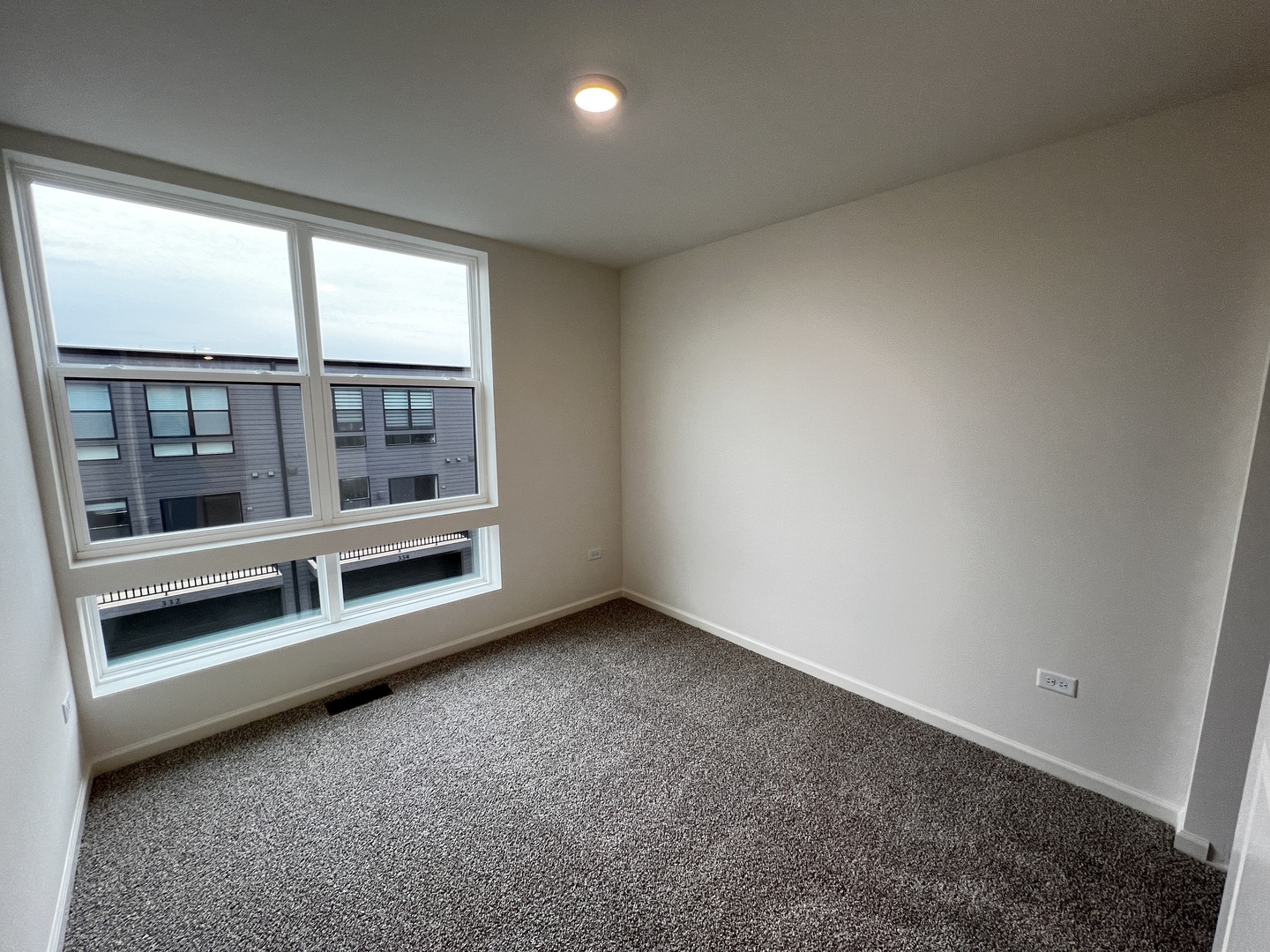 396 Summit Circle Lombard, IL 60148 - Photo 10 of 48 an empty room with wooden floor and windows