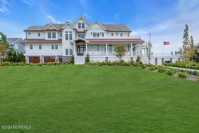 an aerial view of a house with a ocean view