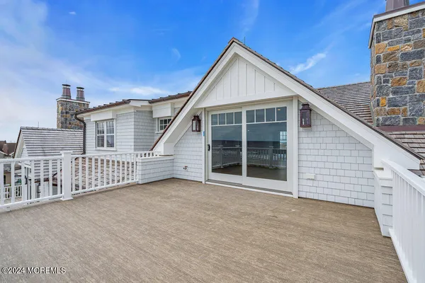 a bathroom with a granite countertop sink mirror and toilet