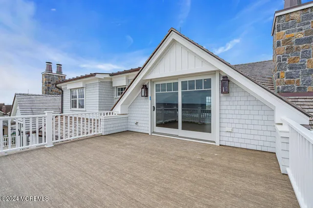 a bathroom with a granite countertop sink mirror and toilet
