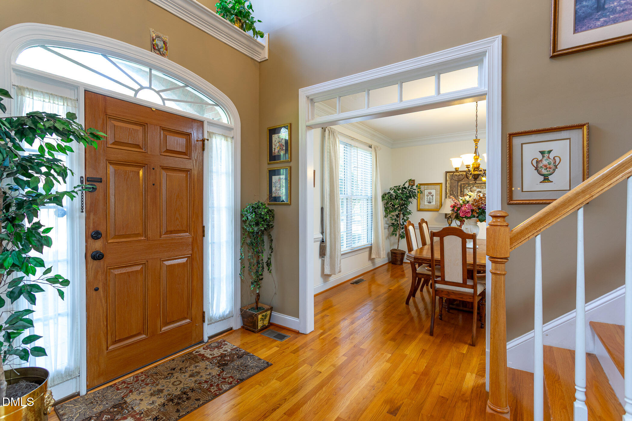 9409 Ray Road Raleigh, NC 27613 - Photo 2 of 47 a view of entryway livingroom and hall with wooden floor