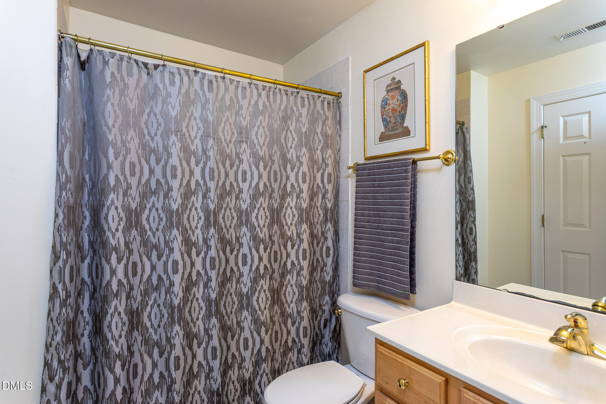 9409 Ray Road Raleigh, NC 27613 - Photo 26 of 47 a bathroom with a sink toilet and shower