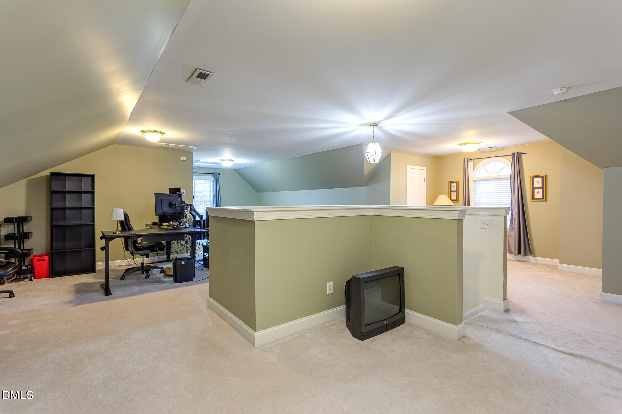 9409 Ray Road Raleigh, NC 27613 - Photo 30 of 47 a view of a livingroom with furniture and a refrigerator