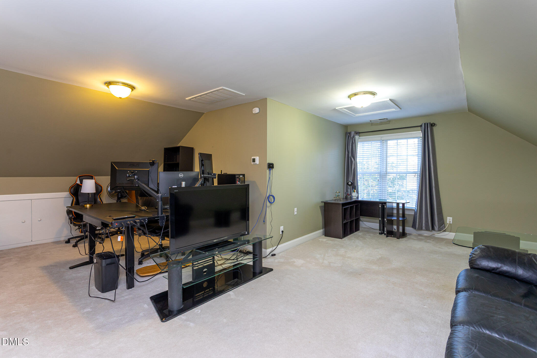 9409 Ray Road Raleigh, NC 27613 - Photo 32 of 47 a view of a livingroom with workspace and a window
