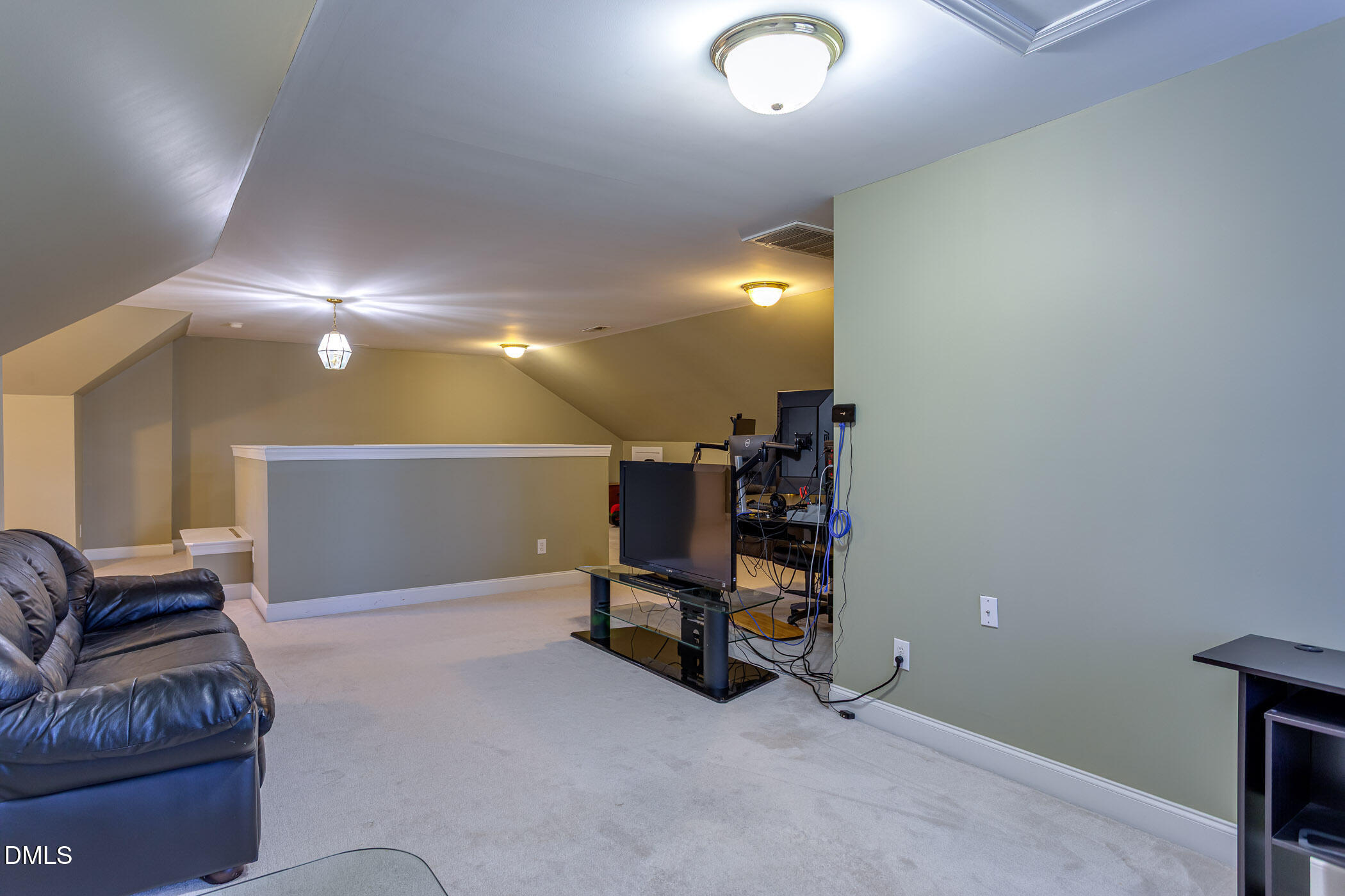 9409 Ray Road Raleigh, NC 27613 - Photo 34 of 47 a living room with furniture and a lamp