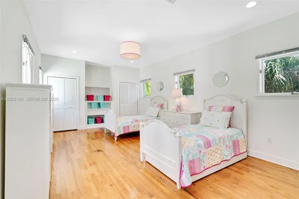 a bed room with a bed and a couch