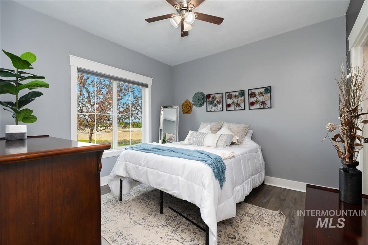 15015 Leon Lane Caldwell, ID 83607 - Photo 24 of 44 Windowed room featuring wood-finish flooring, light gray walls, and white trim