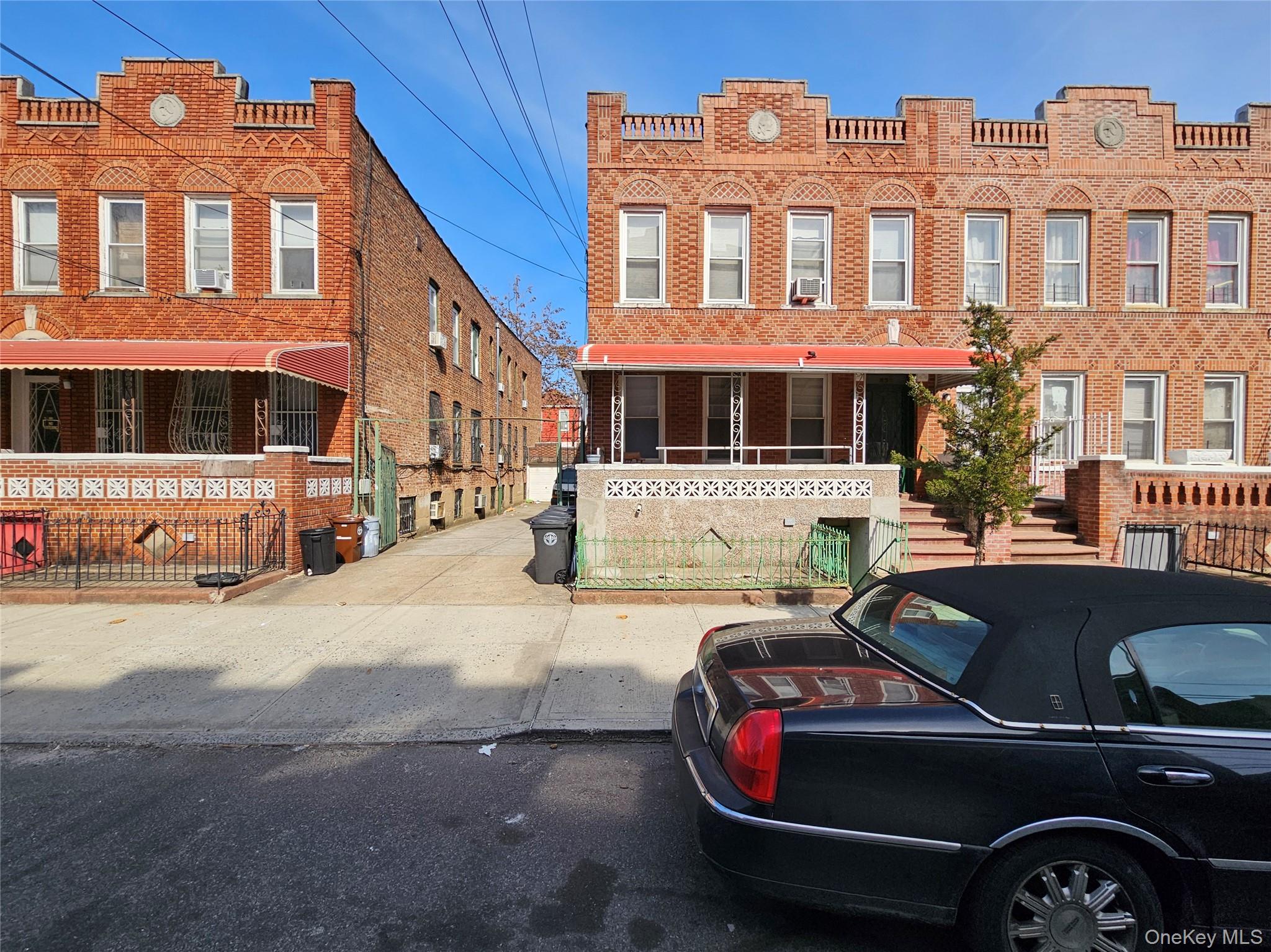 539 East 96th Street, Unit 4 Brooklyn, NY 11212 - Photo 2 of 3 a front view of a house with parking space