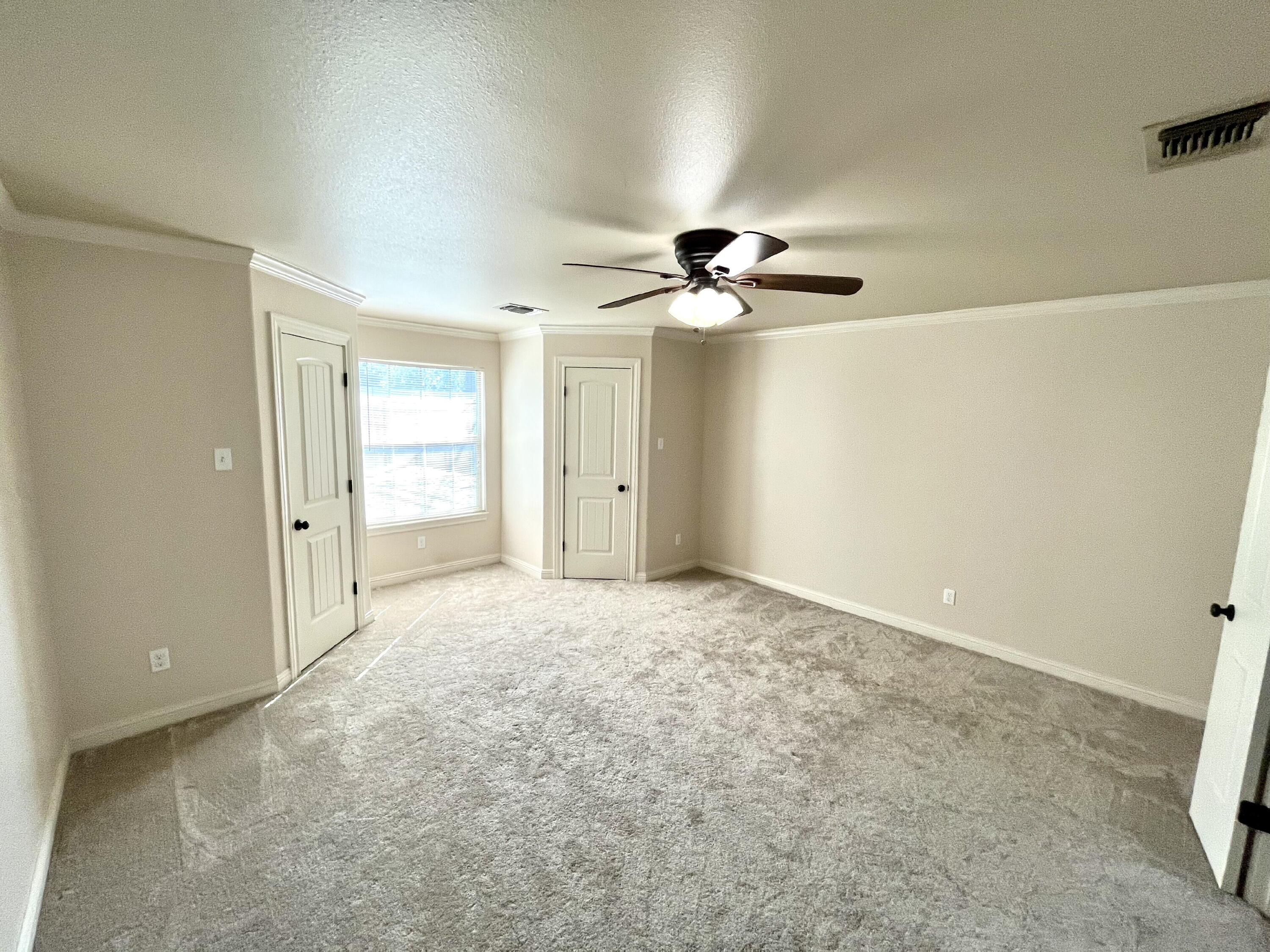 3321 55th Street Lubbock, TX 79413 - Photo 19 of 26 a view of an empty room and chandelier fan