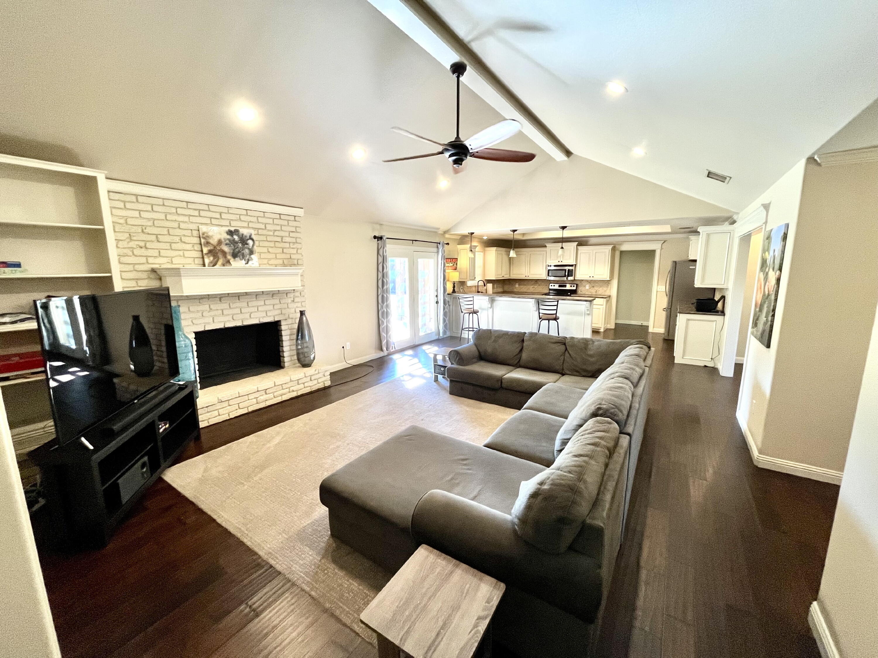 3321 55th Street Lubbock, TX 79413 - Photo 3 of 26 a living room with furniture and a flat screen tv