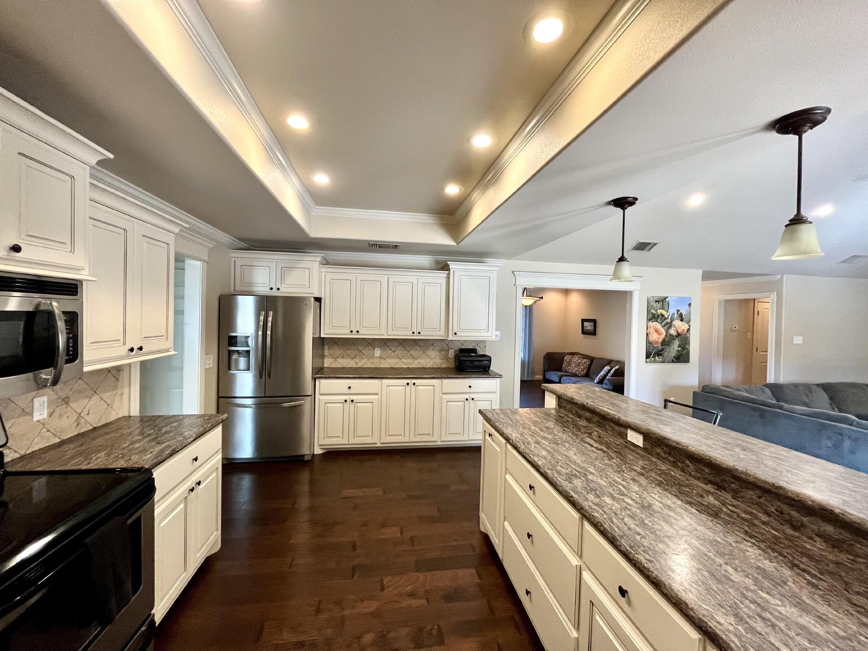 3321 55th Street Lubbock, TX 79413 - Photo 6 of 26 a large kitchen with stainless steel appliances