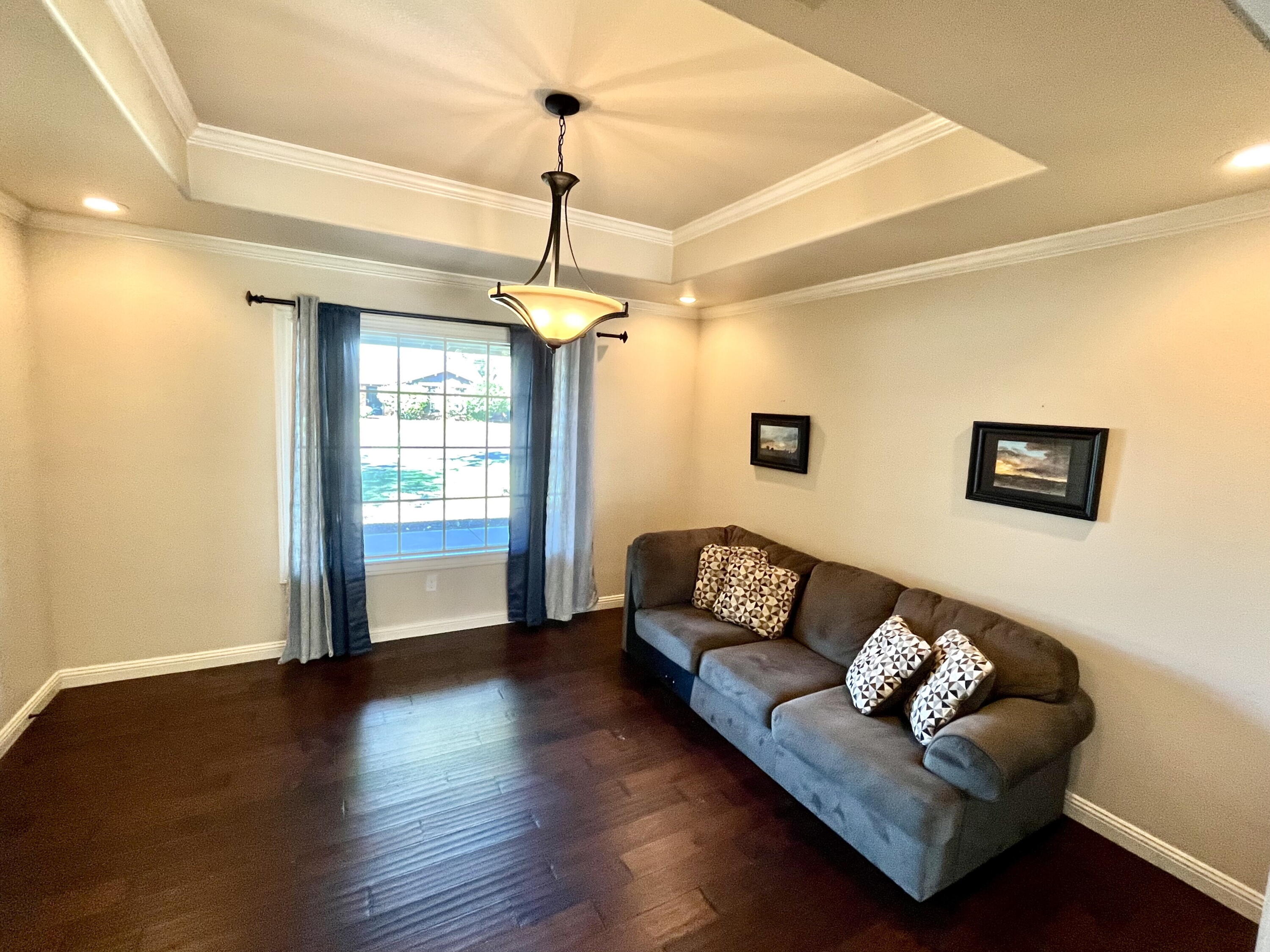 3321 55th Street Lubbock, TX 79413 - Photo 8 of 26 a living room with furniture and a window