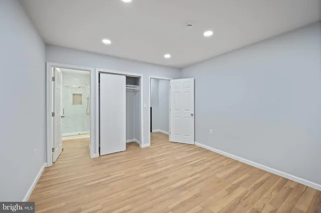 a bathroom with a shower a toilet and a sink