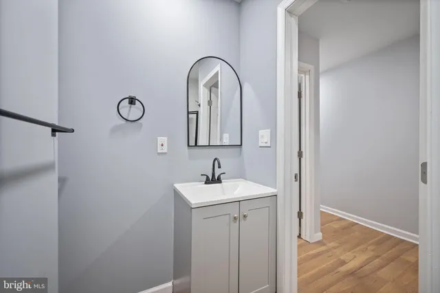 a bathroom with a sink and mirror