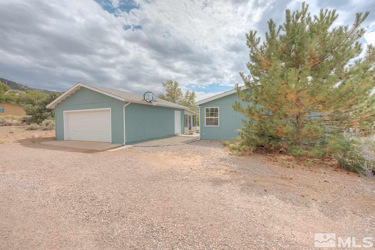 15186 Pinion Drive Reno, NV 89521 - Photo 18 of 20 front view of a house with a dry trees