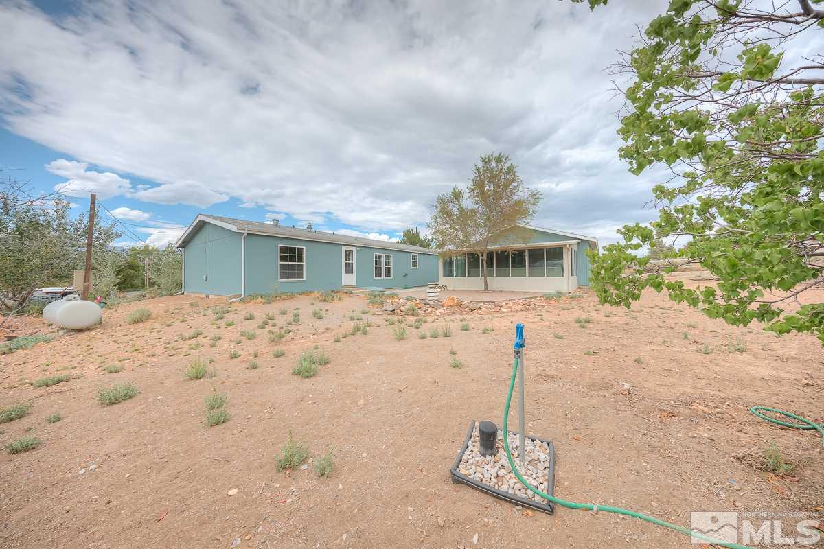 15186 Pinion Drive Reno, NV 89521 - Photo 19 of 20 a front view of a house with a yard
