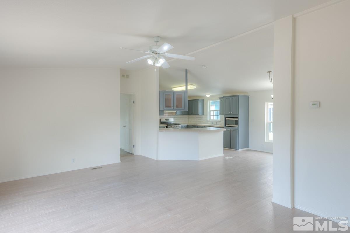 15186 Pinion Drive Reno, NV 89521 - Photo 3 of 20 a view of an empty room and kitchen view
